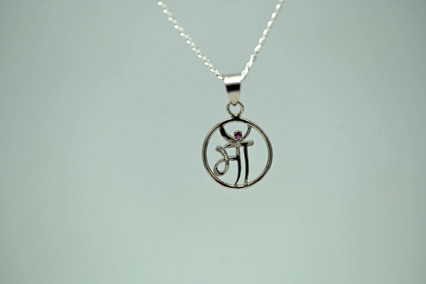 "Maa" Sanskrit Script Silver Pendant with Ruby Accent