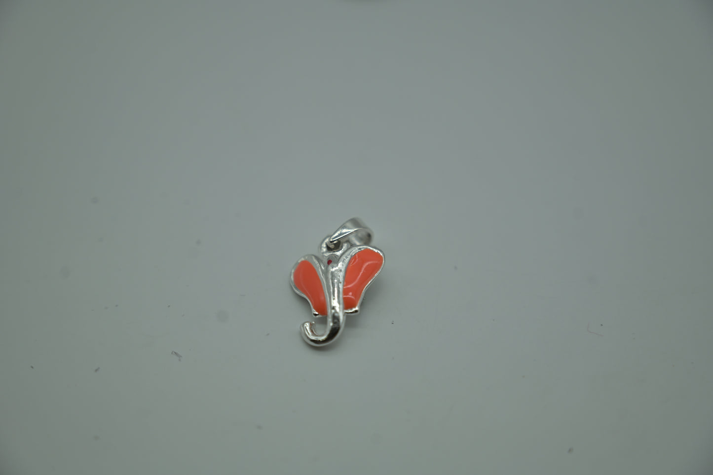 Silver Ganesha Head Pendant with Orange Enamel Accents